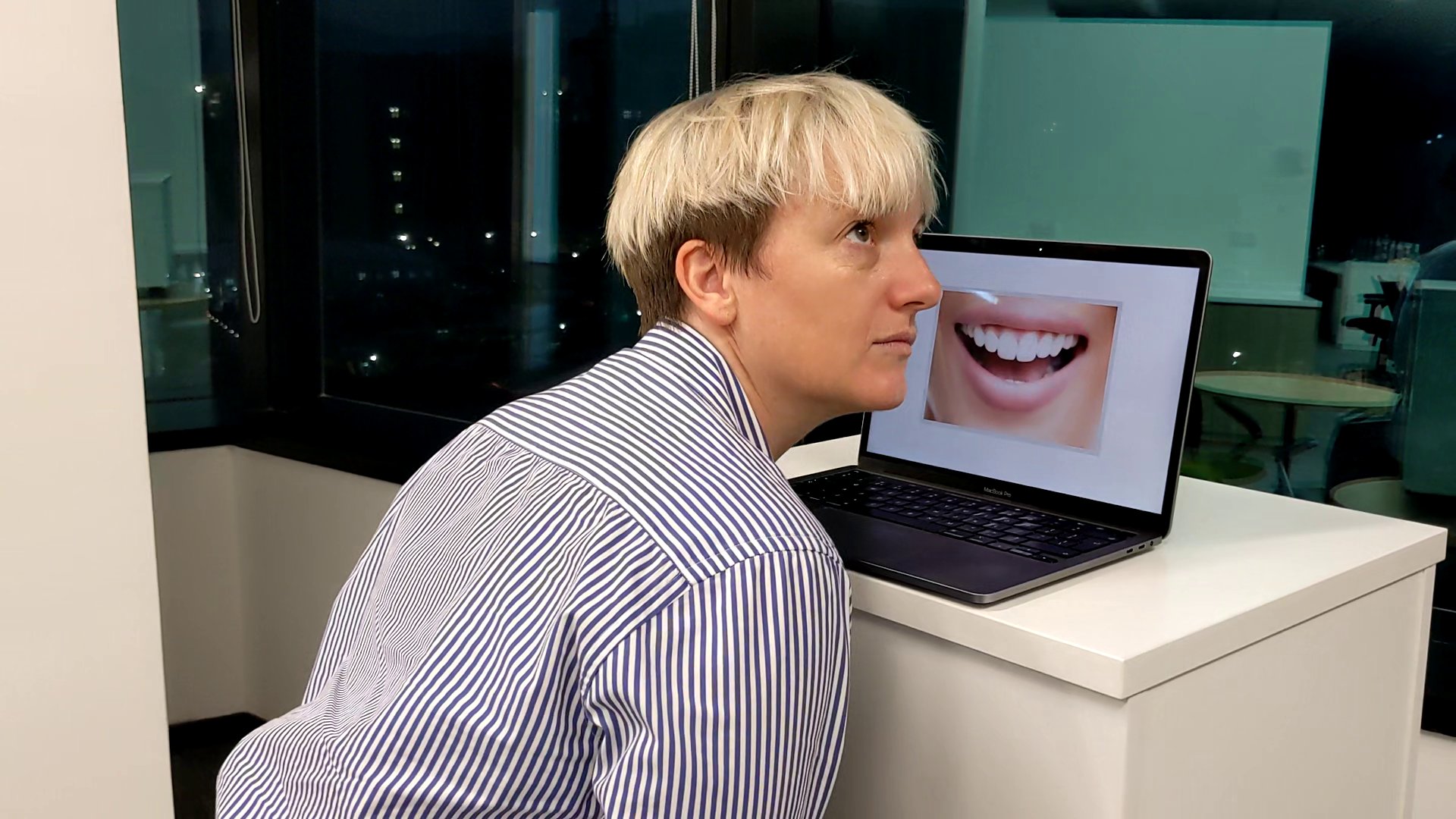 Testing Fear Exchange: a person listening to a mouth shown on a laptop screen