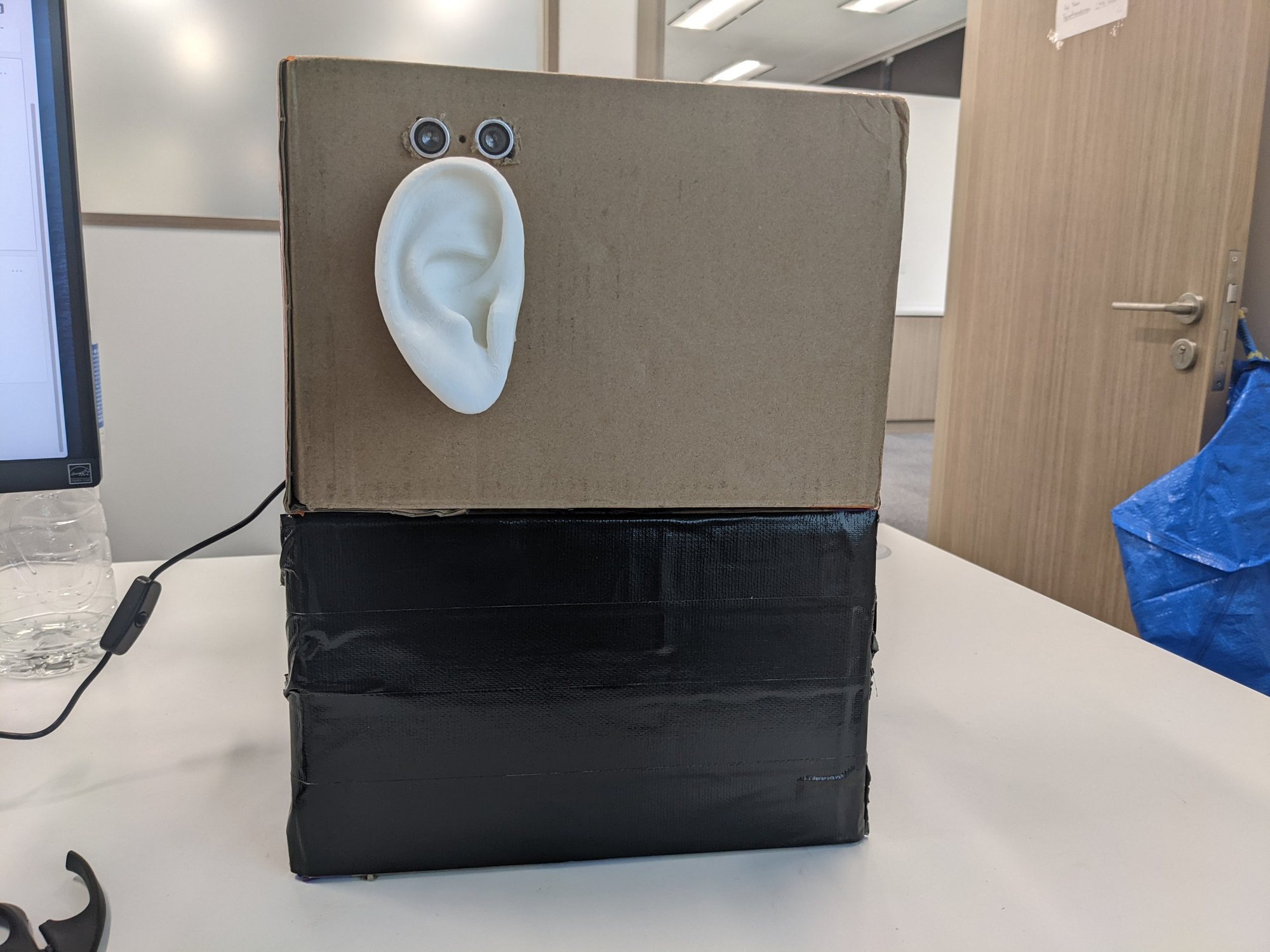 Cardboard prototype of the Fear Exchange ear unit