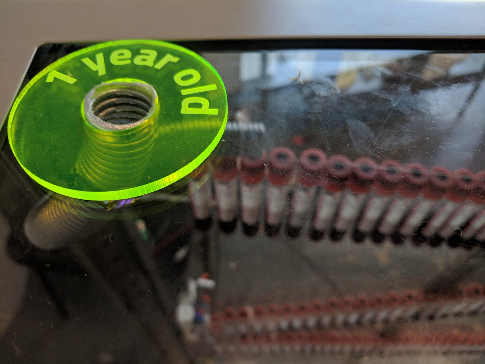 Acrylic '1 year old' marker on a marble run made of blood sample tubes