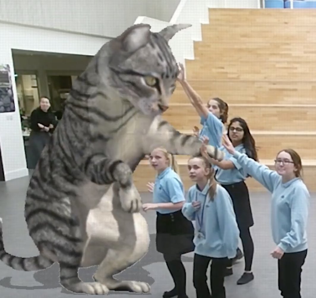Cinder: schoolchildren reaching up to a giant augmented-reality cat