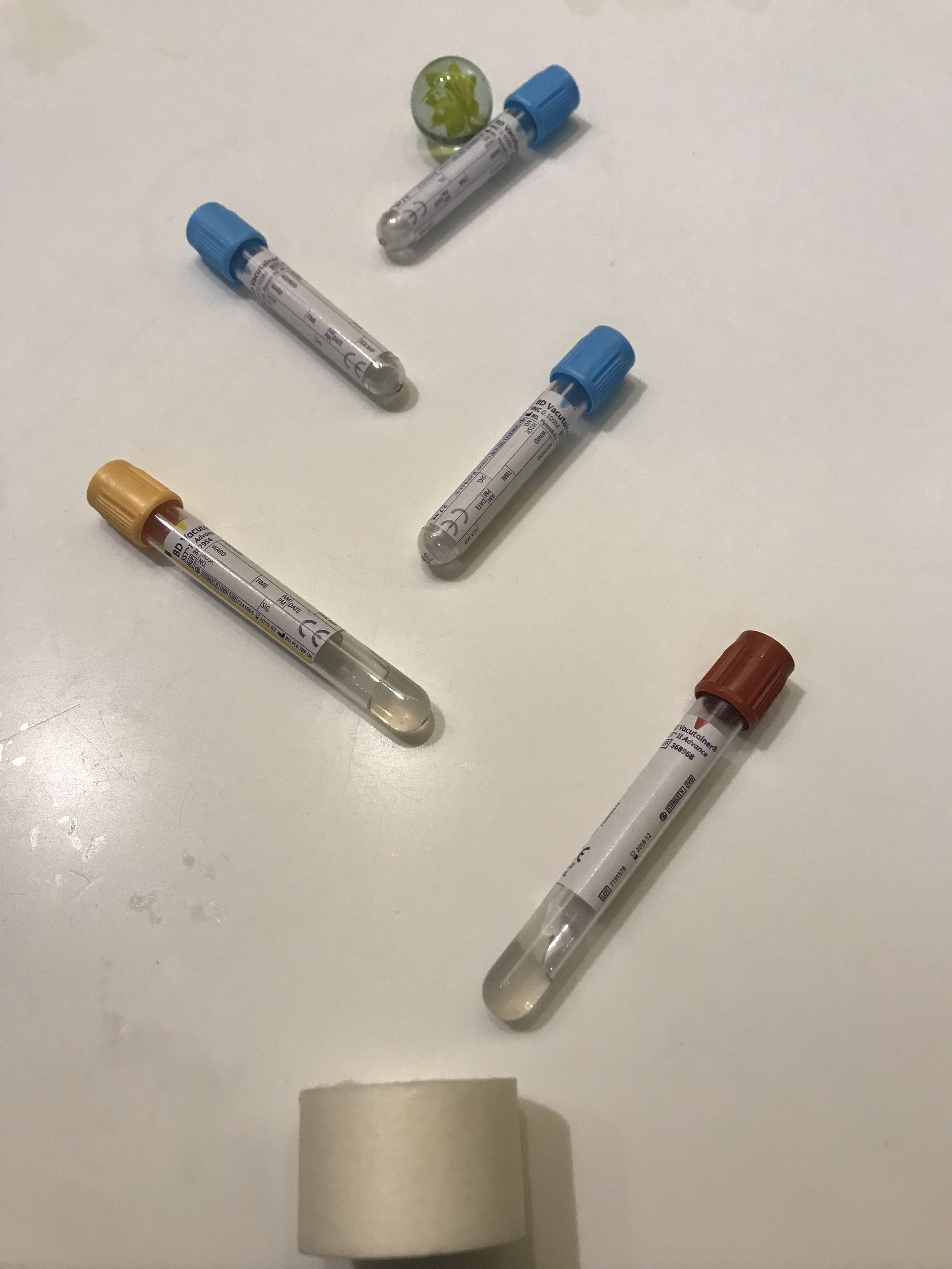 Blood sample tubes and a marble